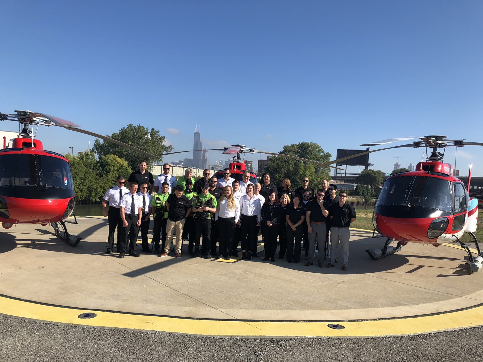 The Chicago Helicopter Experience team and fleet at the heliport