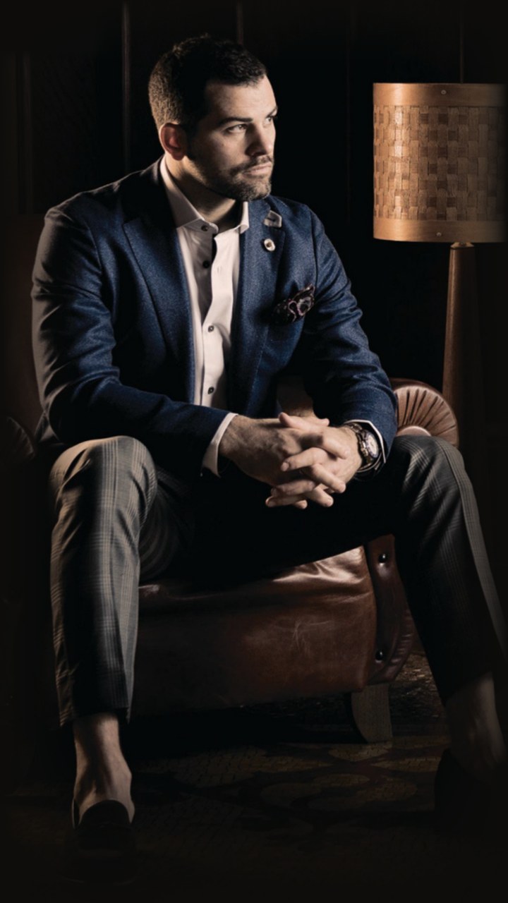 Trevor Heffernan seated in a leather chair